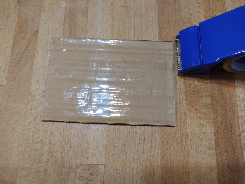 グリルの火が付かいのを解決する段ボールにテープを張る